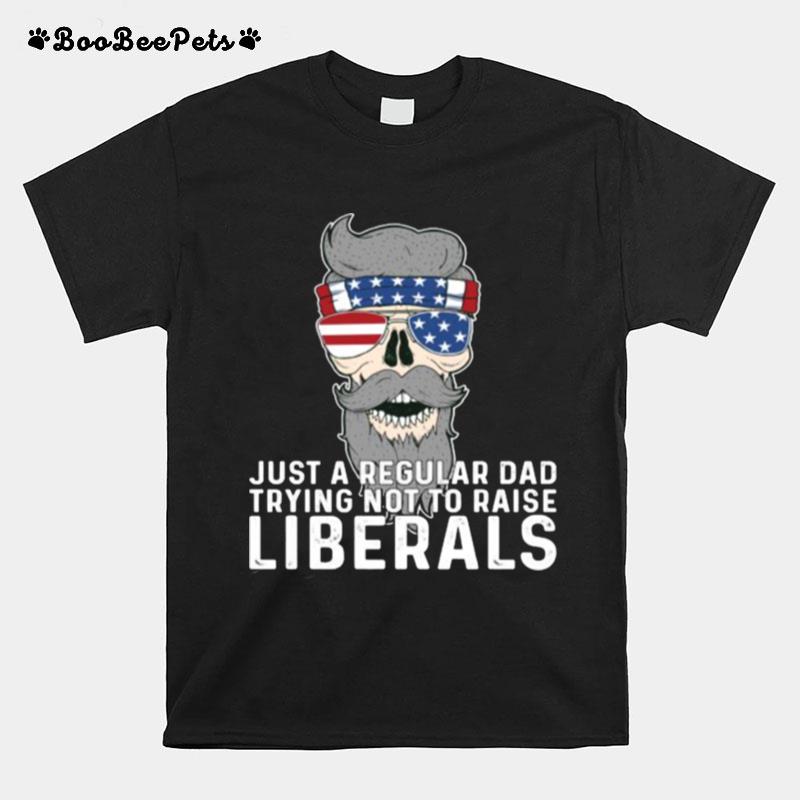 Just A Regular Dad Trying Not To Raise Liberals Usa Skull Sunglasses American Flag T-Shirt